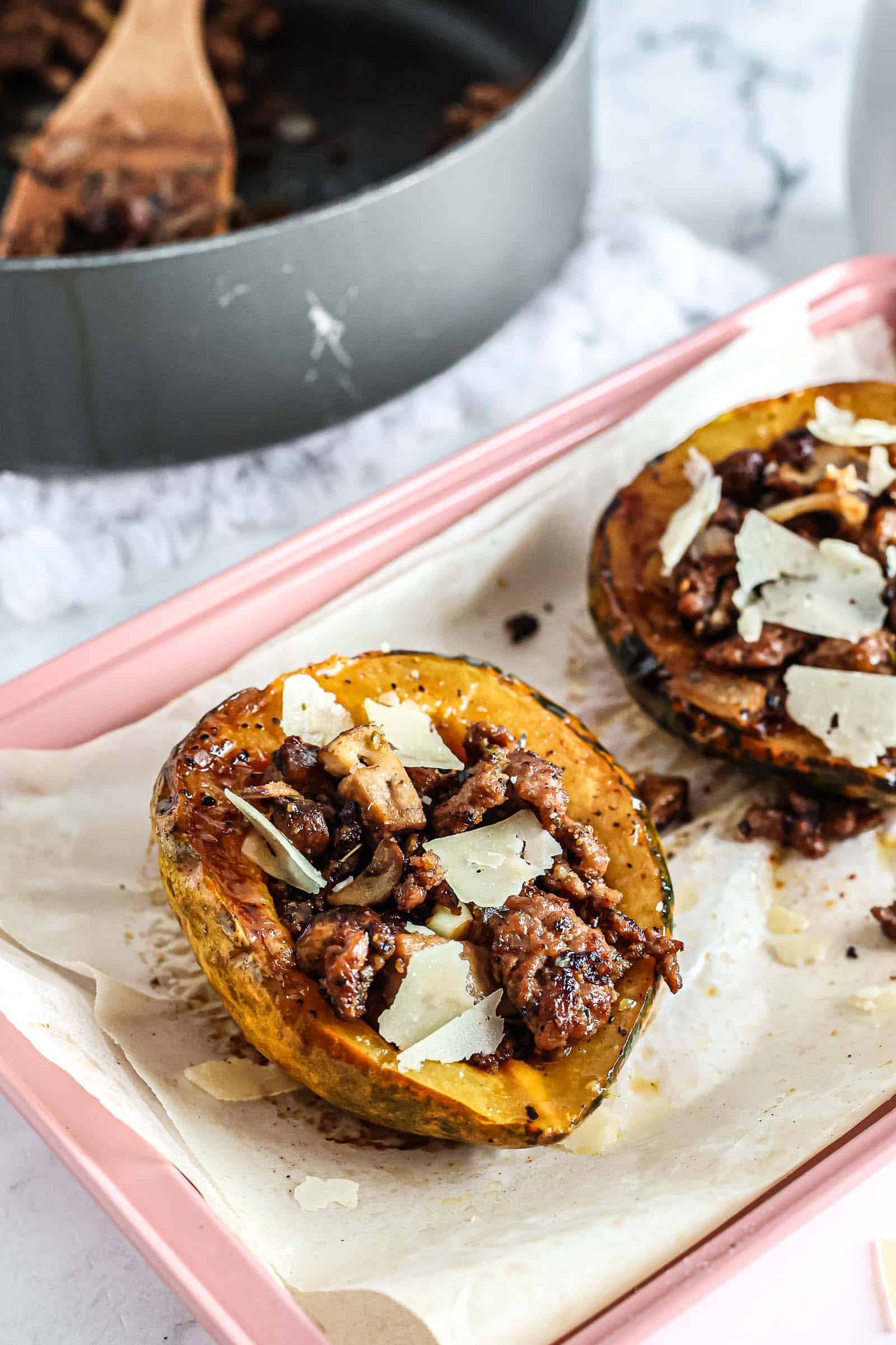 Sausage and Mushroom Stuffed Acorn Squash on baking sheet