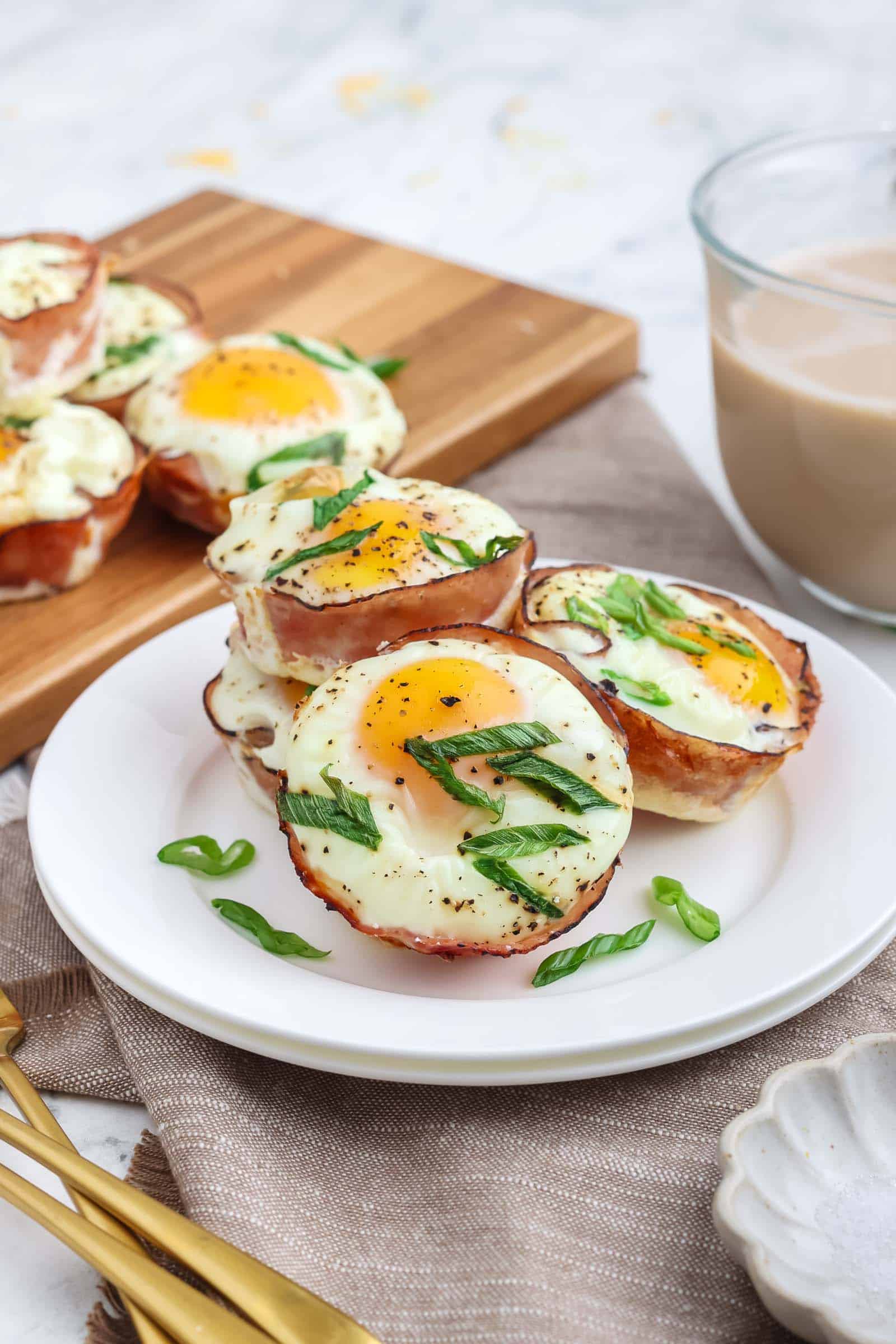 Ham and Cheese Egg Cups served on a white plate