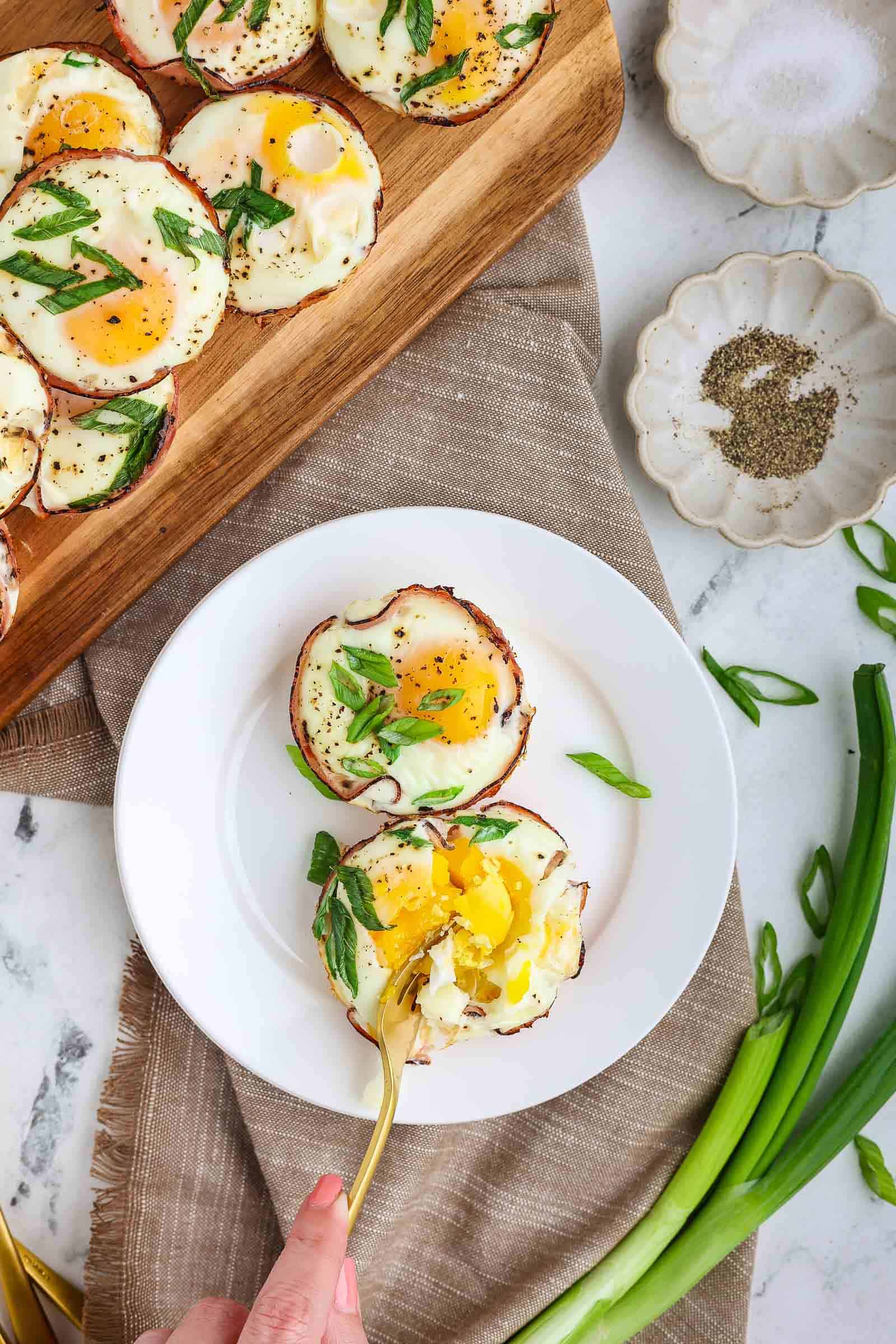 Hame and Cheese Eggs Cups served on a plate