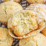 Lemon Poppy Seed Muffins stacked on a rack