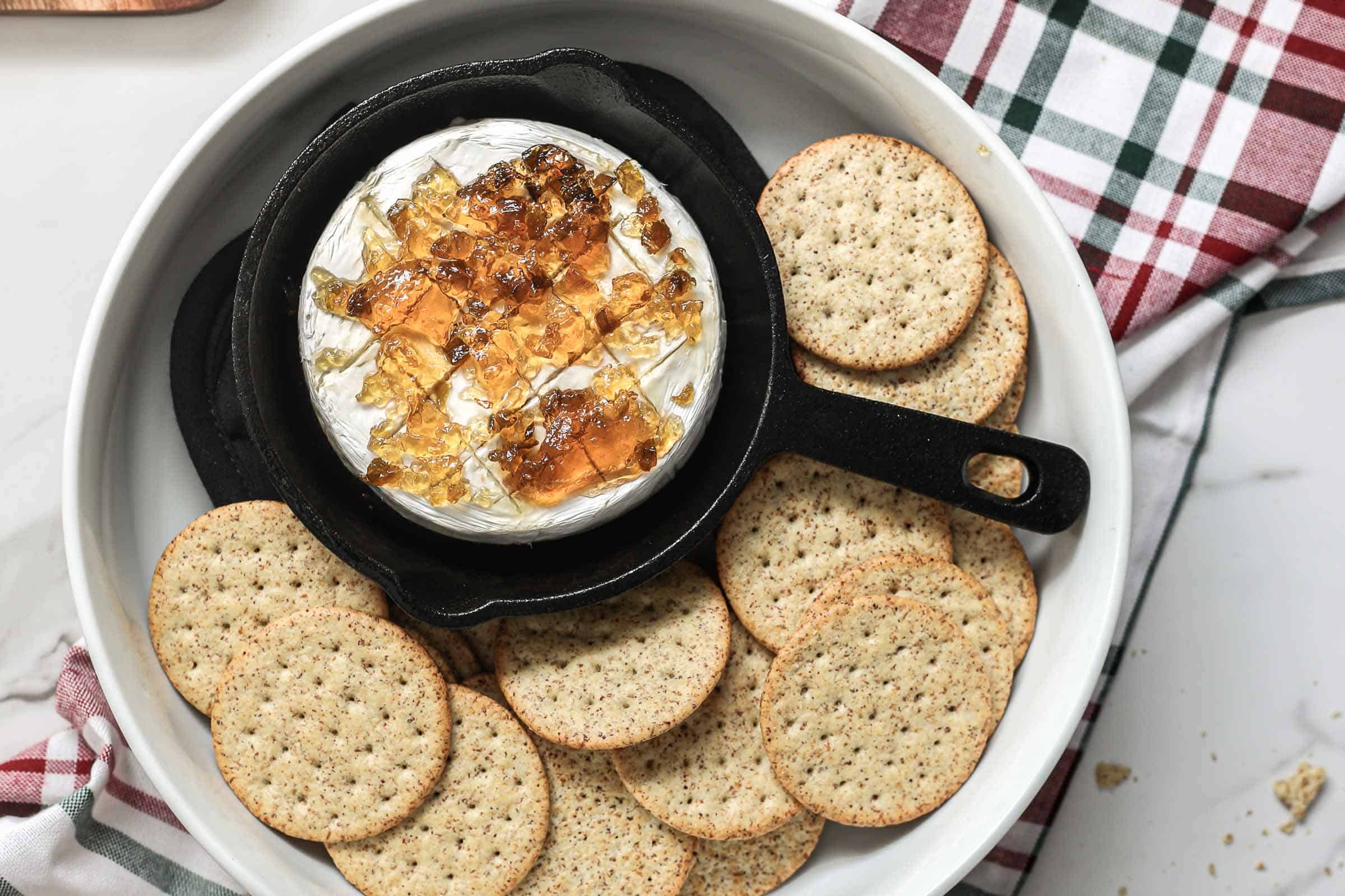 Baked Brie with Red Pepper Jelly Appetizer served with crackers