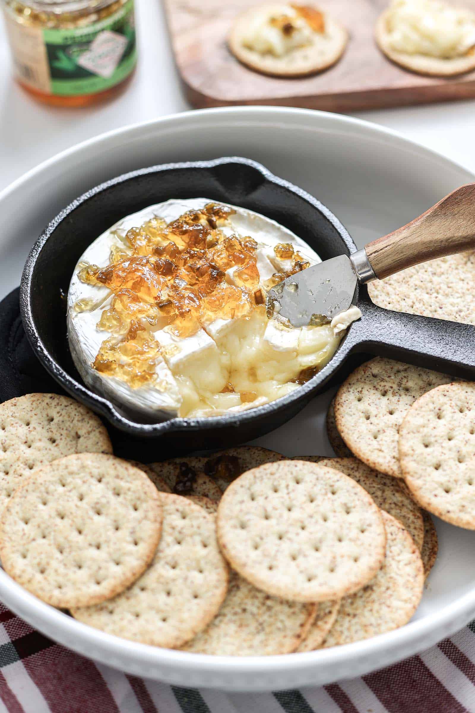 Baked Brie with Red Pepper Jelly Appetizer served with crackers