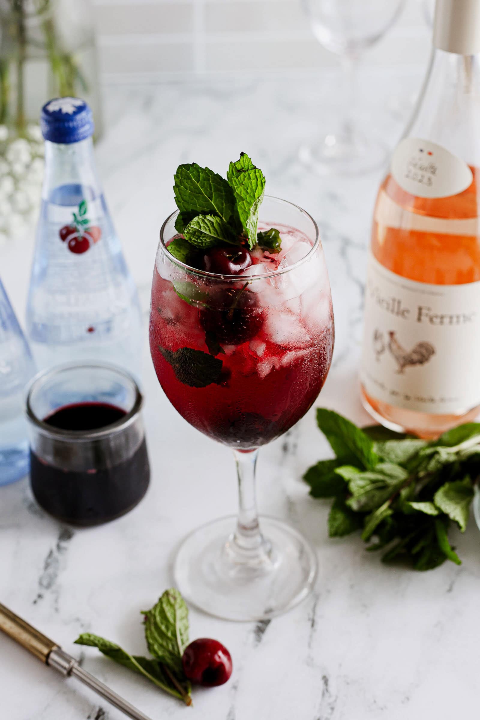 Cherry & Mint Wine Spritzer garnished.