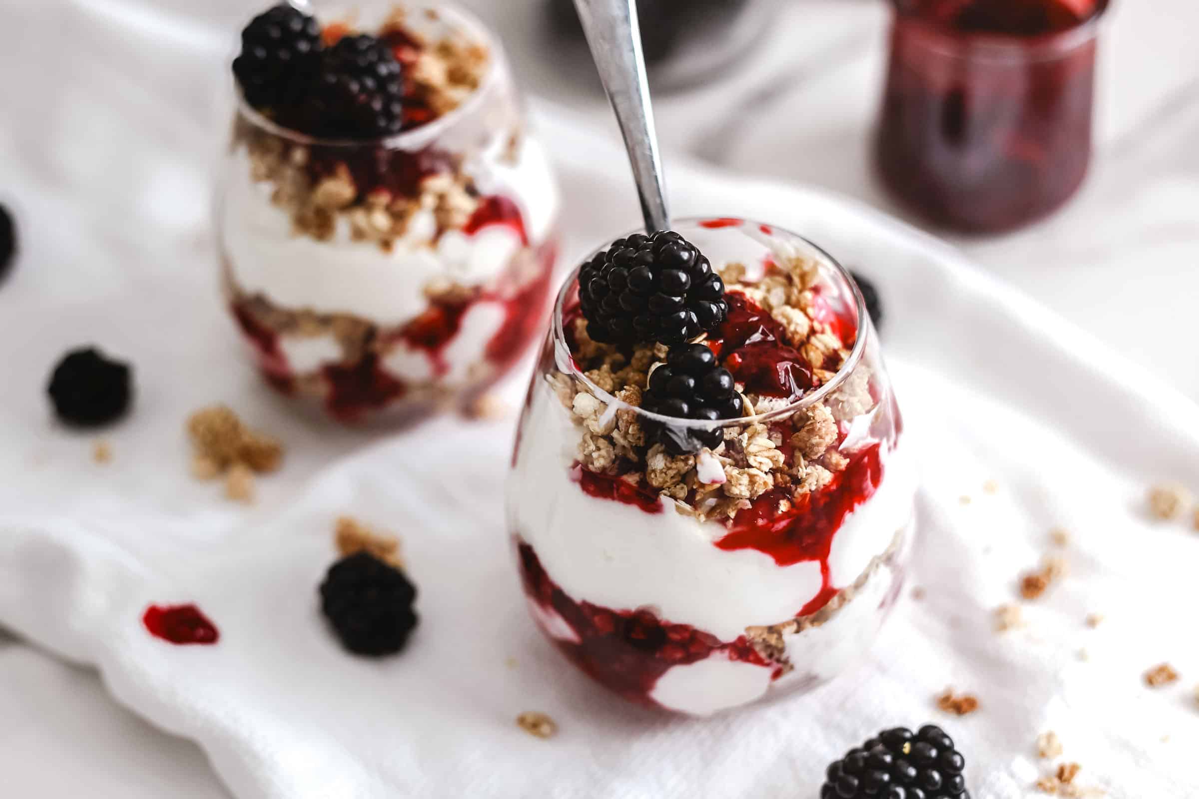 Two blackberry parfaits ready to eat.