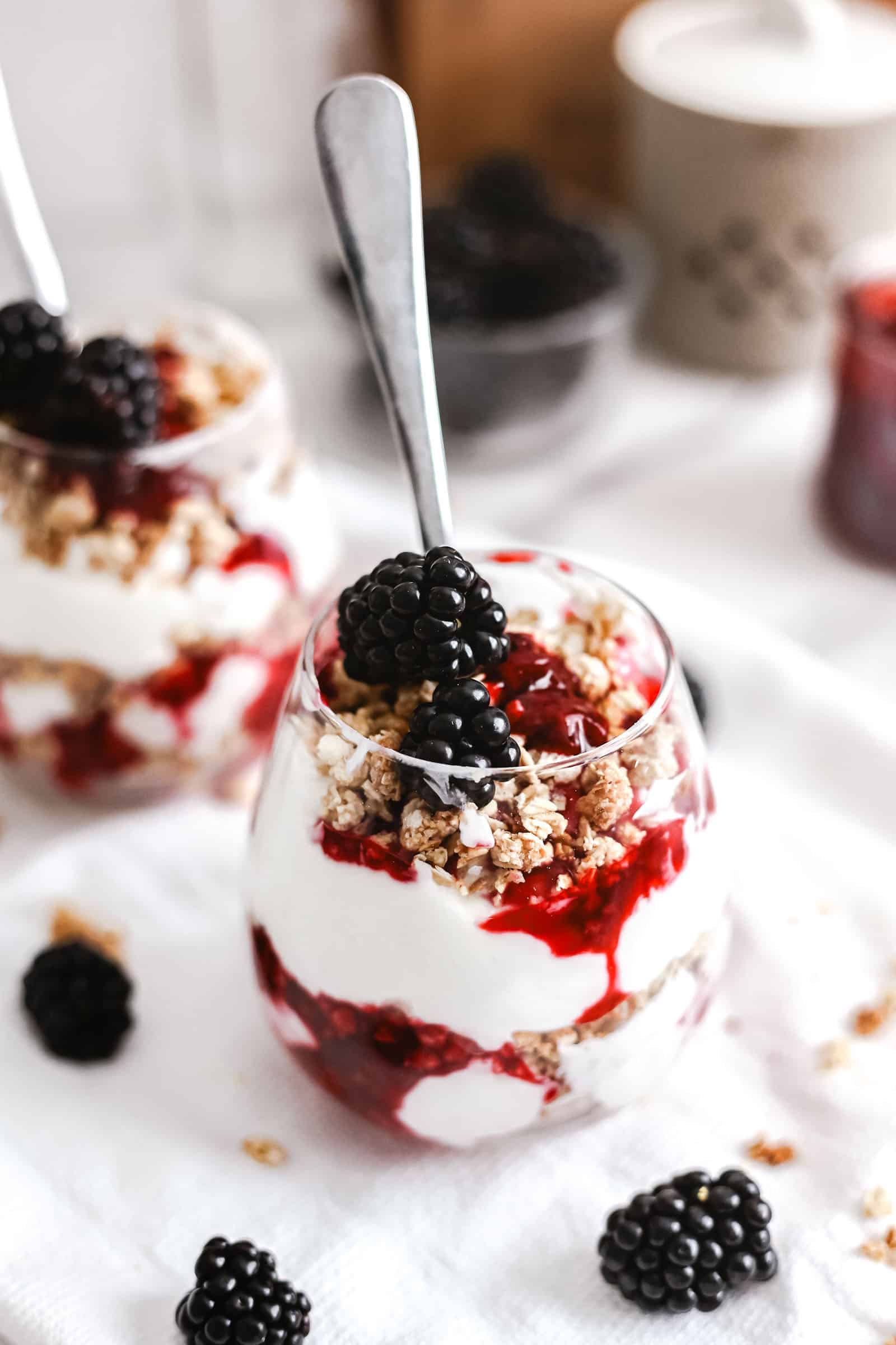 Two blackberry parfaits ready to eat. Close up of one of the parfaits.
