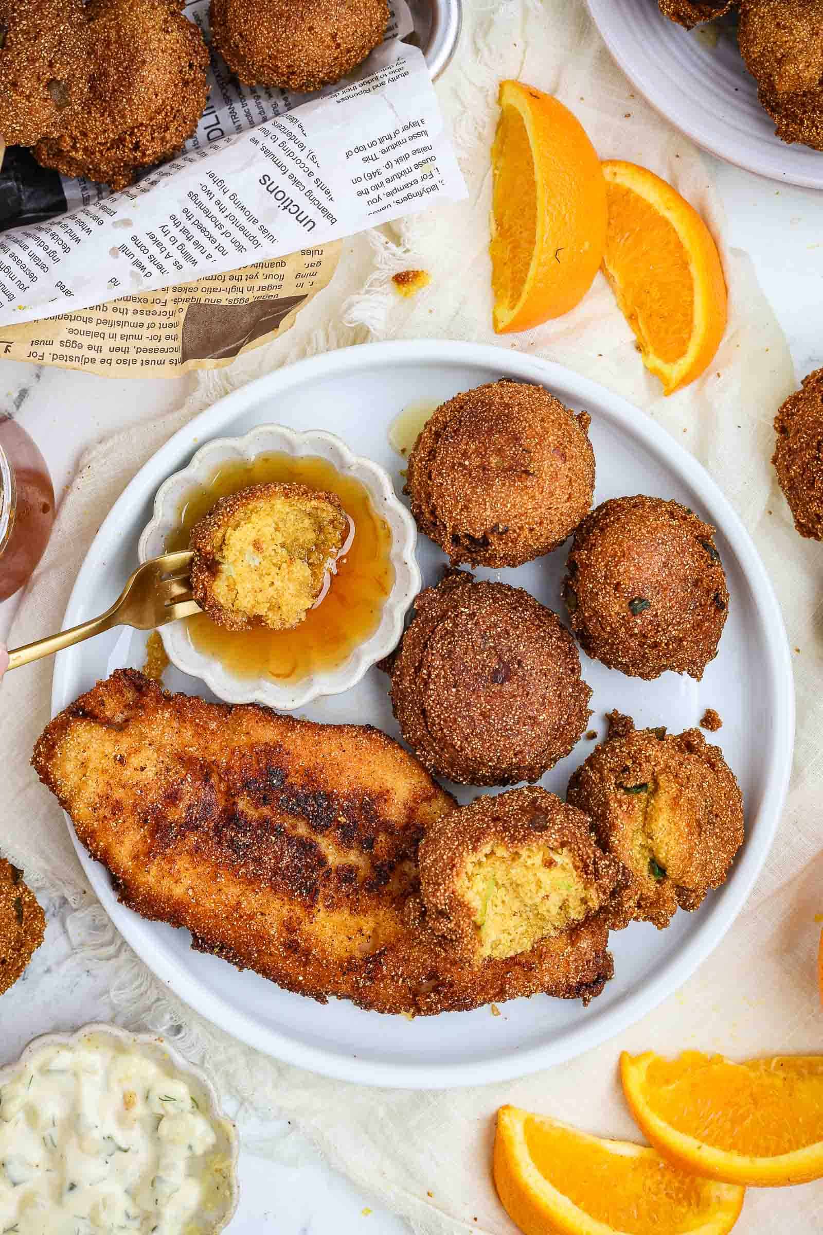 Hush puppies and fried catfish on a plate